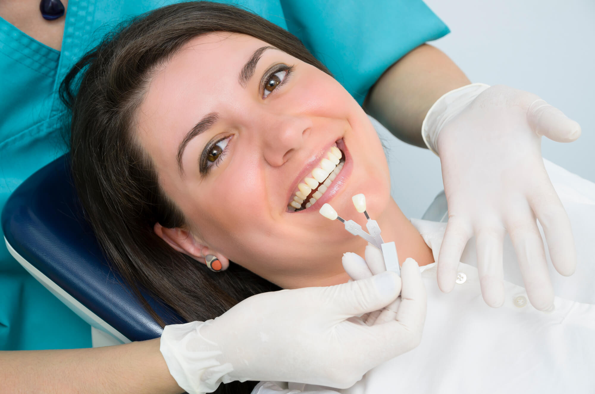 dentist placing dental implants miami