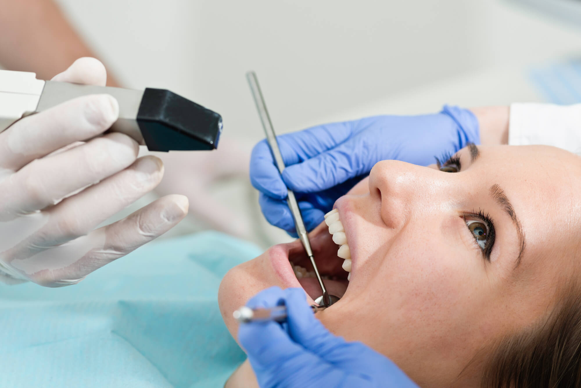 Cosmetic Dentist in Miami checks patients teeth
